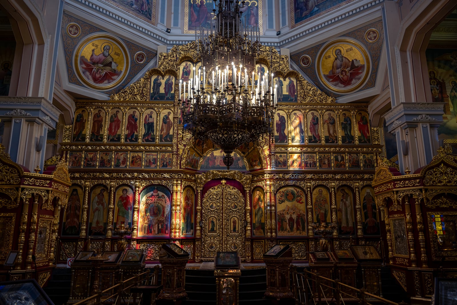 Gilded iconostasis and chandelier inside the Orthodox cathedral