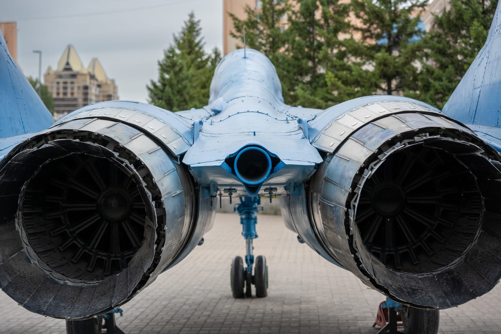 Symmetrical rear view of twin fighter-jet engine nozzles